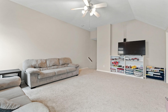 carpeted living area with ceiling fan and vaulted ceiling