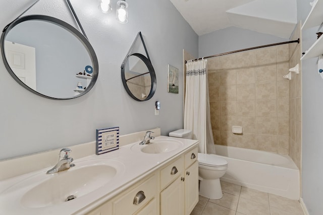 bathroom with shower / bath combination with curtain, tile patterned flooring, a sink, and toilet