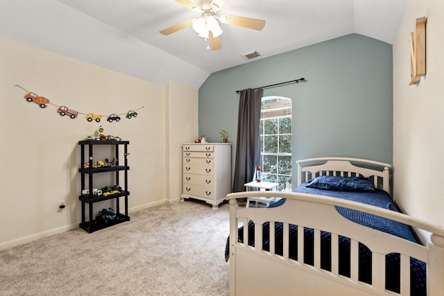 bedroom with lofted ceiling, visible vents, light carpet, and baseboards