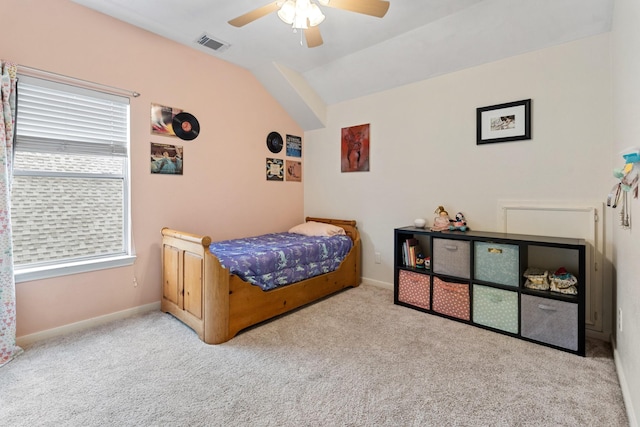 bedroom featuring lofted ceiling, baseboards, light carpet, and visible vents