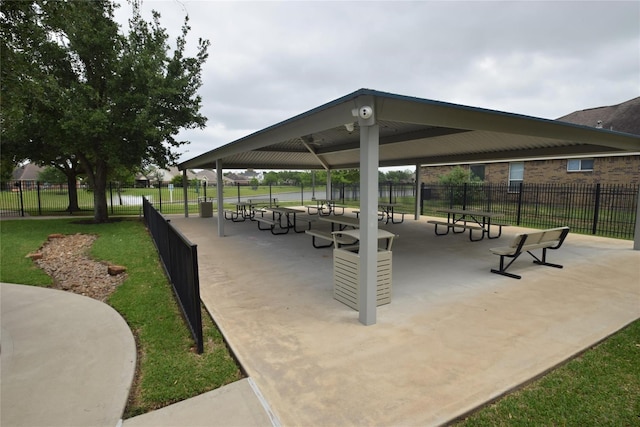 surrounding community featuring fence and a yard