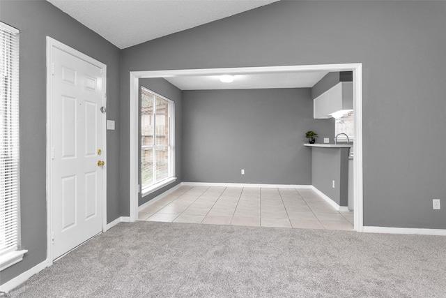 11330 Sunfish Ln, Houston, TX 77067 - tiled foyer entrance featuring carpet and baseboards