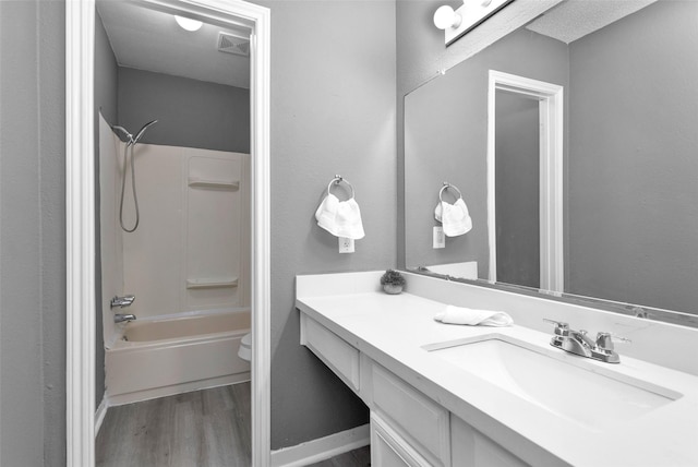 11330 Sunfish Ln, Houston, TX 77067 - bathroom with wood finished floors, vanity, toilet, and shower / washtub combination