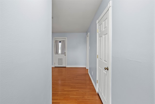 11707 Bowie Dr, La Porte, TX 77571 - hallway featuring light wood finished floors and baseboards