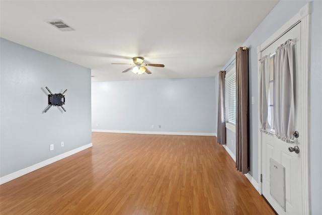 11707 Bowie Dr, La Porte, TX 77571 - interior space with a ceiling fan, visible vents, light wood-style flooring, and baseboards