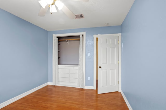 11707 Bowie Dr, La Porte, TX 77571 - unfurnished bedroom with visible vents, baseboards, and wood finished floors