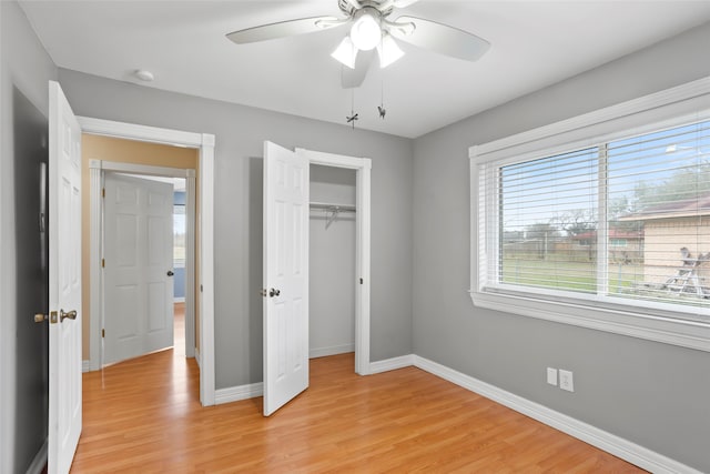 11707 Bowie Dr, La Porte, TX 77571 - unfurnished bedroom featuring baseboards, ceiling fan, a closet, and light wood-style floors