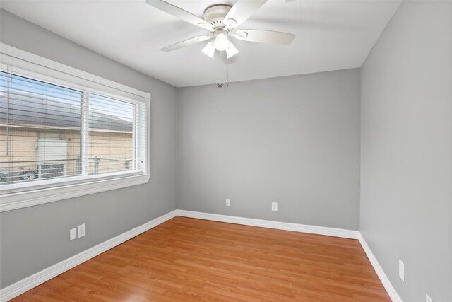 11707 Bowie Dr, La Porte, TX 77571 - empty room with light wood-style floors, baseboards, and a ceiling fan