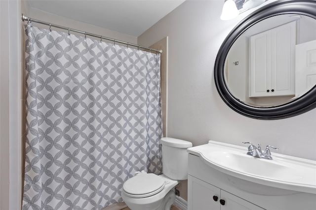 11707 Bowie Dr, La Porte, TX 77571 - bathroom with toilet, curtained shower, and vanity