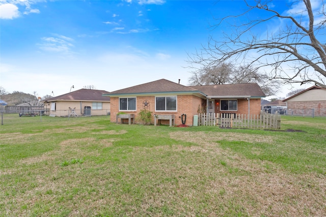 11707 Bowie Dr, La Porte, TX 77571 - back of house with central AC, brick siding, a lawn, and fence private yard