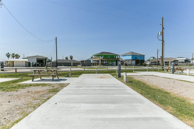 view of home's community featuring a residential view and fence