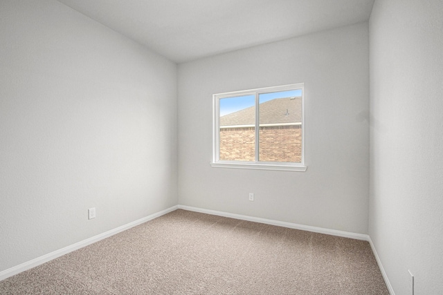 411 Wellshire Dr, West Columbia, TX 77486 - carpeted empty room with baseboards