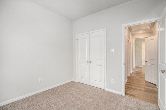 411 Wellshire Dr, West Columbia, TX 77486 - unfurnished bedroom featuring attic access, a closet, and carpet floors