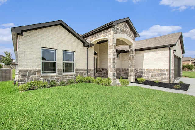 411 Wellshire Dr, West Columbia, TX 77486 - french country style house with a front lawn, a garage, and brick siding