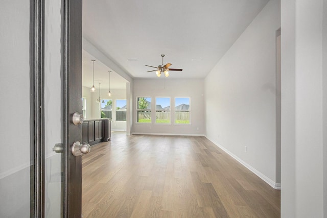 411 Wellshire Dr, West Columbia, TX 77486 - unfurnished living room featuring light wood finished floors and a ceiling fan