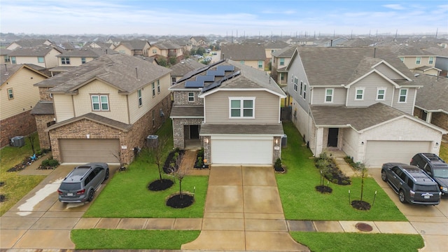 view of front of home featuring solar panels, a front lawn, and a residential view