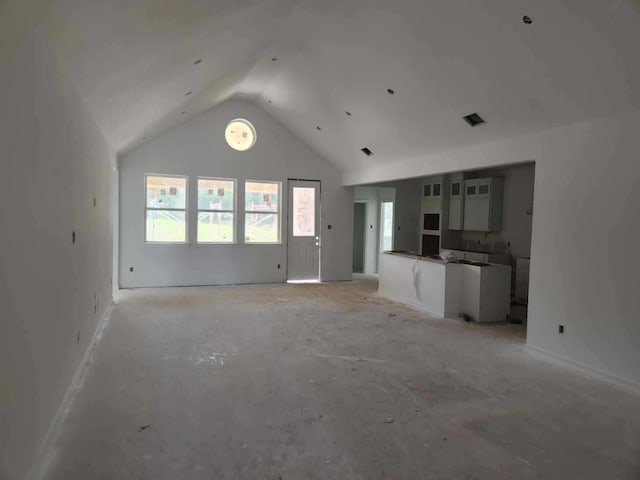 128 Luther Dean Ln, New Waverly, TX 77358 - unfurnished living room featuring lofted ceiling