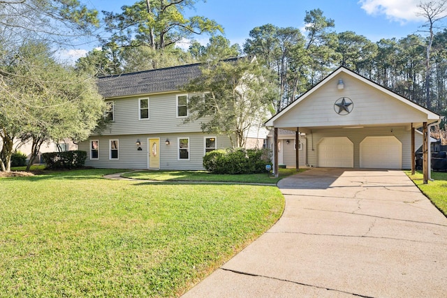 colonial home featuring a front yard and a detached garage