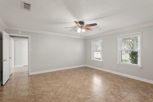 empty room featuring baseboards, ornamental molding, visible vents, and a ceiling fan