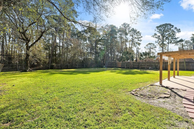 view of yard with a fenced backyard and a pergola