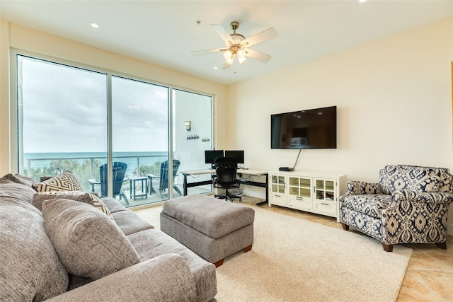 living area featuring light tile patterned floors, ceiling fan, and recessed lighting