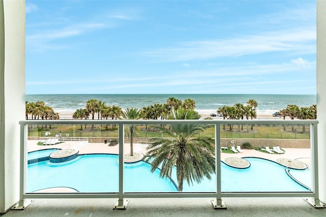 balcony featuring a water view