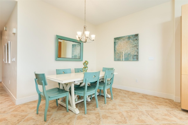 tiled dining room with baseboards and a chandelier