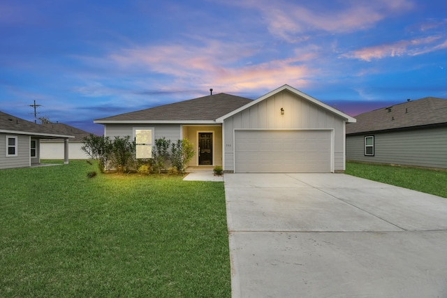 view of front of property featuring a garage, driveway, board and batten siding, and a lawn