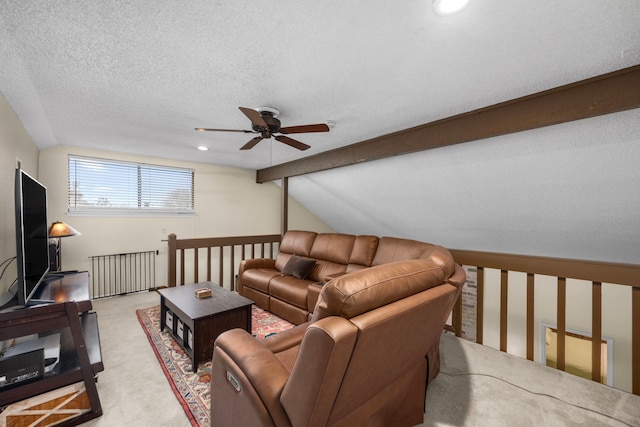 living room with radiator, lofted ceiling with beams, a ceiling fan, light carpet, and a textured ceiling