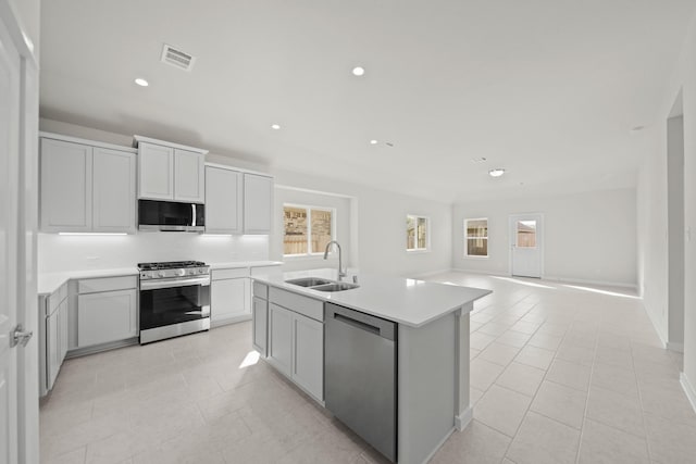 kitchen with visible vents, plenty of natural light, stainless steel appliances, and a sink