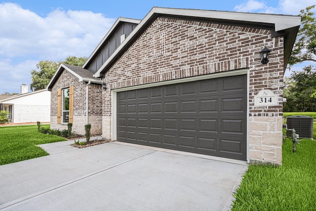 314 Wellshire Dr, West Columbia, TX 77486 - view of front facade featuring board and batten siding, a garage, brick siding, concrete driveway, and a front lawn