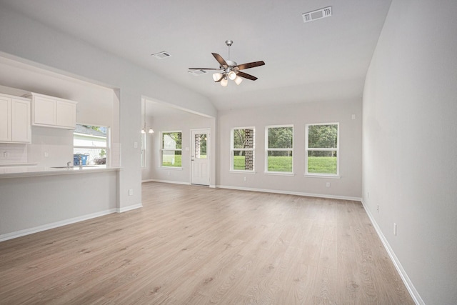 314 Wellshire Dr, West Columbia, TX 77486 - unfurnished living room featuring ceiling fan, lofted ceiling, and light wood-style flooring