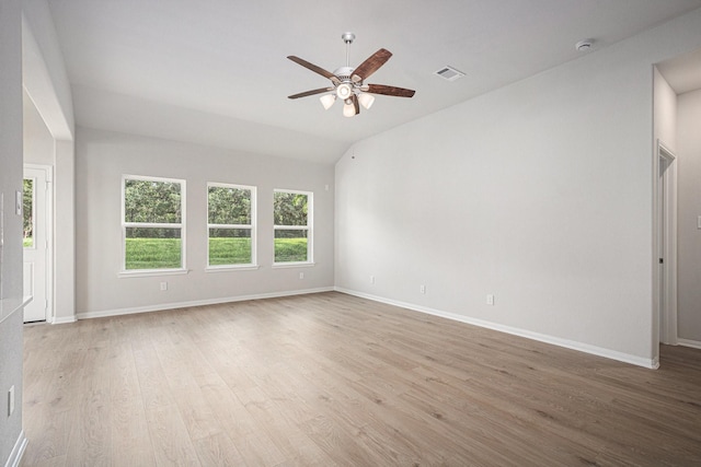 314 Wellshire Dr, West Columbia, TX 77486 - unfurnished room featuring a ceiling fan, light wood-style floors, vaulted ceiling, and a smoke detector