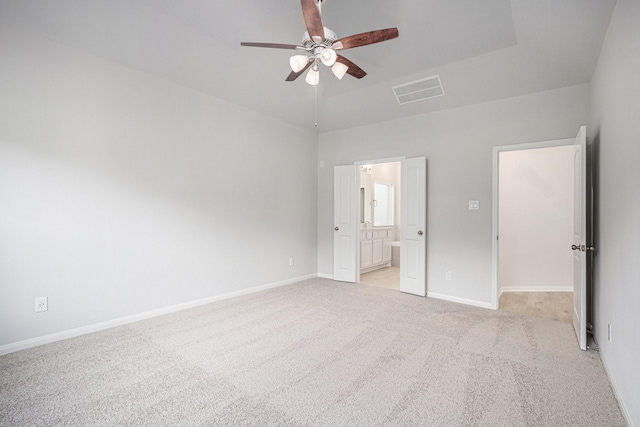 314 Wellshire Dr, West Columbia, TX 77486 - unfurnished bedroom featuring light colored carpet, ensuite bathroom, ceiling fan, and a high ceiling