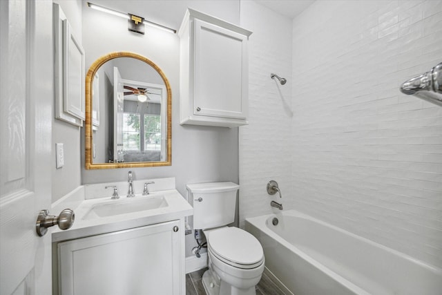 bathroom with vanity, toilet, and shower / bathtub combination