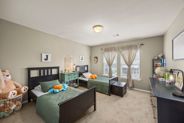 bedroom featuring light carpet, visible vents, and baseboards