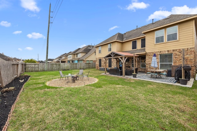 view of yard with a fenced backyard, a patio, and a gazebo