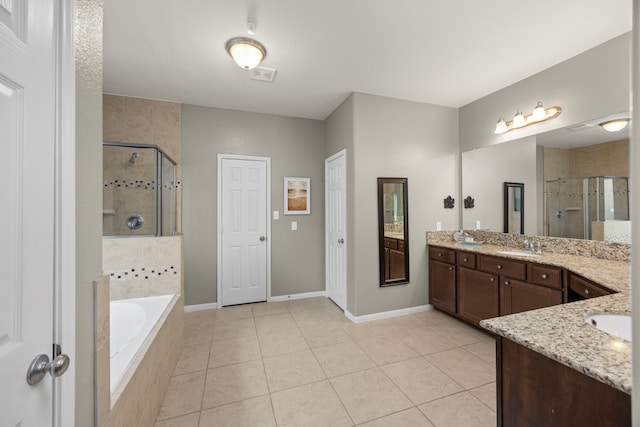 full bathroom with tile patterned floors, a garden tub, vanity, and a shower stall