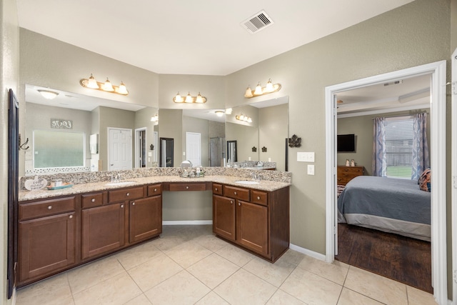 bathroom featuring vanity, tile patterned flooring, ensuite bath, and visible vents