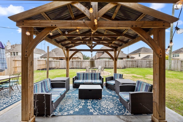 view of patio featuring an outdoor hangout area, a gazebo, and a fenced backyard