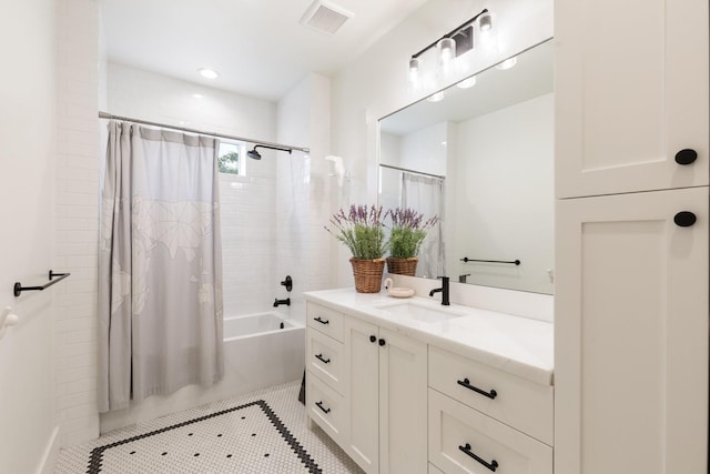 bathroom featuring shower / tub combo, vanity, visible vents, and tile patterned floors