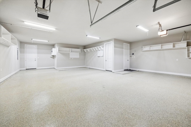 garage featuring baseboards and a garage door opener