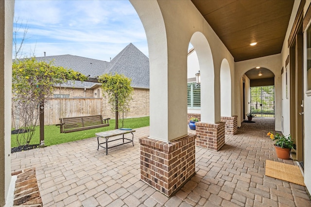 view of patio / terrace featuring fence