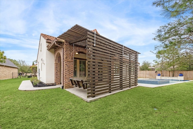 rear view of property featuring a lawn, fence, a fenced in pool, and a pergola