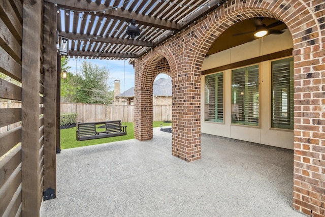 view of patio with fence and a pergola