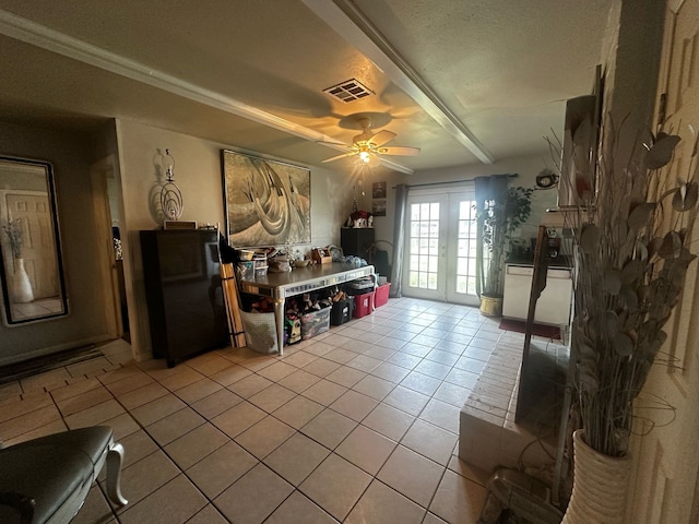 interior space featuring light tile patterned floors, french doors, visible vents, and a ceiling fan