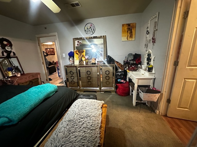 bedroom with ceiling fan and visible vents