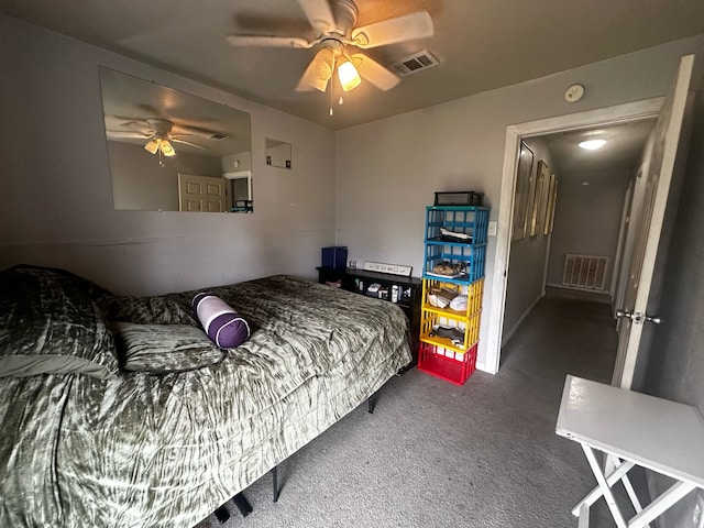 bedroom featuring a ceiling fan, visible vents, and carpet flooring