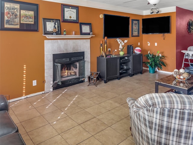 tiled living room with baseboards and a tiled fireplace