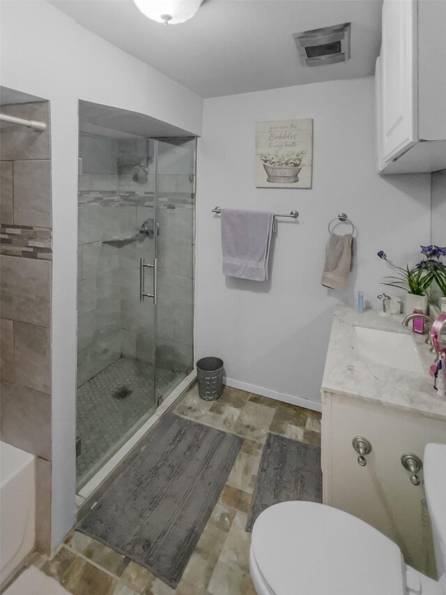 bathroom with toilet, a shower stall, visible vents, and vanity